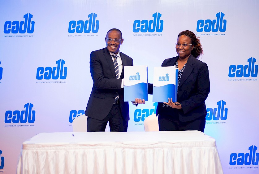 EADB Ag. Director General Benard Mono poses for a photo with Azania Bank Managing Director Esther G. Mang’enya after signing of a TZs 13.2 billion loan agreement
